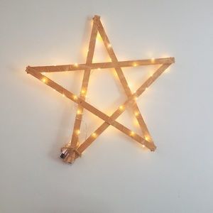 Handmade wooden star with copper fairy lights